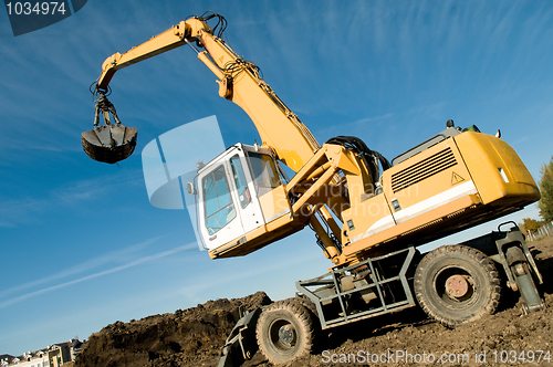 Image of wheel loader excavator at work