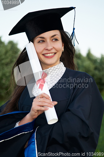 Image of happy smiley graduate girl with diploma