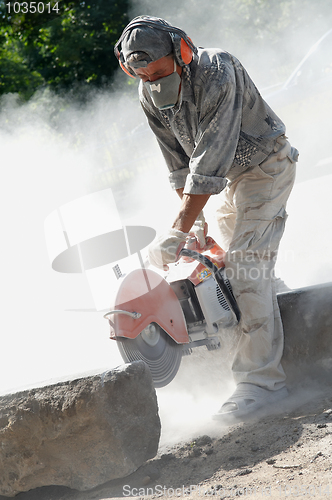 Image of builder at cutting work