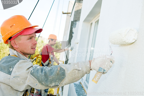 Image of builder facade painter at work