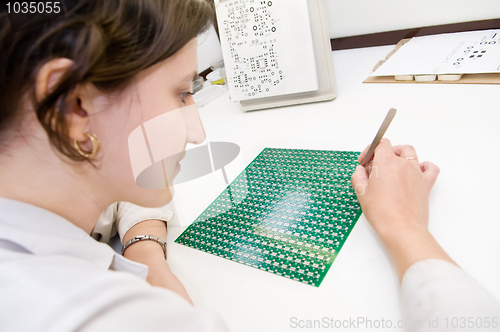 Image of integrated microcircuit chip worker