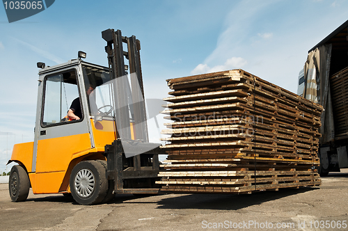 Image of forklift loader warehouse works