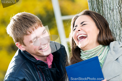 Image of Pair of happy students outdoors