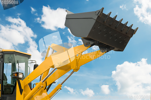 Image of risen loader shovel