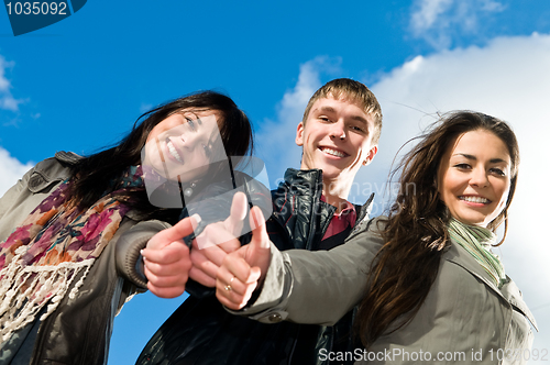 Image of Group of smiling young students outdoors