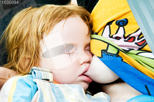 Image of Sleeping child breastfeeding