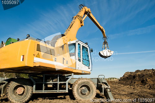 Image of wheel loader excavator at work