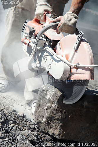 Image of stone cutting work with saw