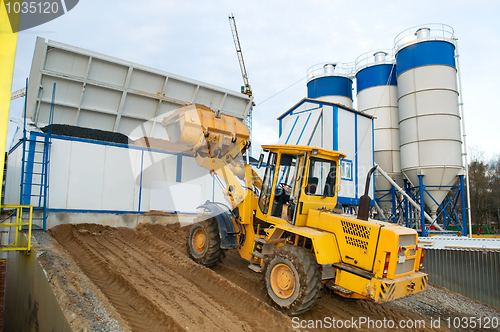 Image of loader works at concrete plant