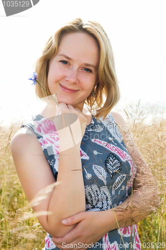 Image of Portrait of happy woman outdoors
