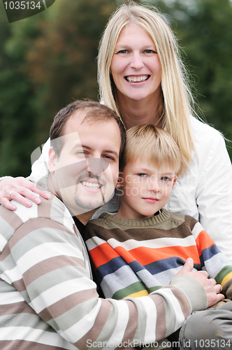 Image of Happy family outdoors