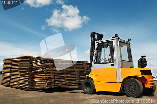 Image of forklift loader at warehouse works 