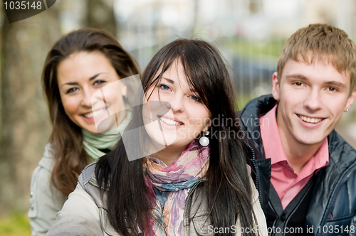 Image of Group of smiling young students outdoors