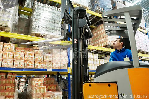 Image of warehouse stacker loader worker