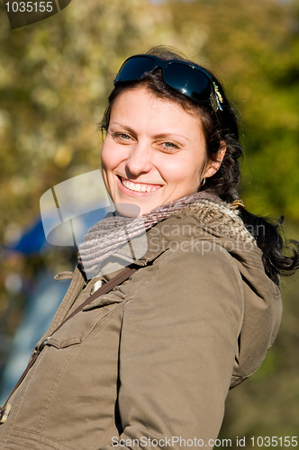 Image of Portrait of happy woman outdoors