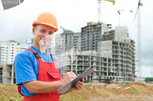 Image of smiling Builder inspector at construction area