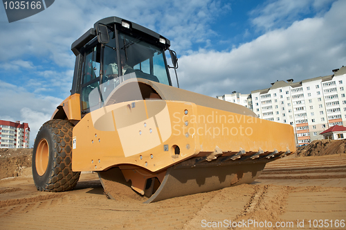 Image of soil vibration compactor at work