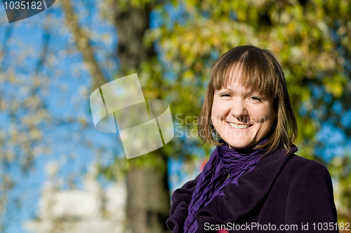 Image of Portrait of cheerful student outdoors