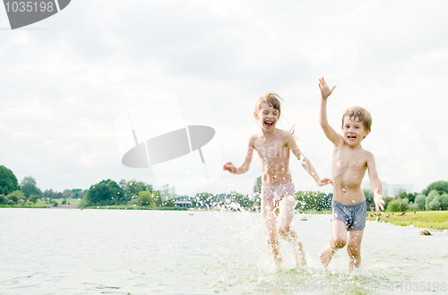 Image of funny happy children in water