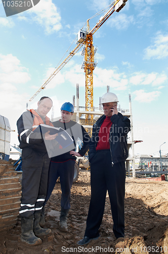 Image of builders at construction site