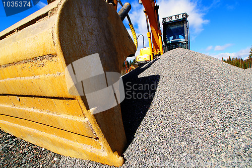 Image of excavator on construction of industrial factory