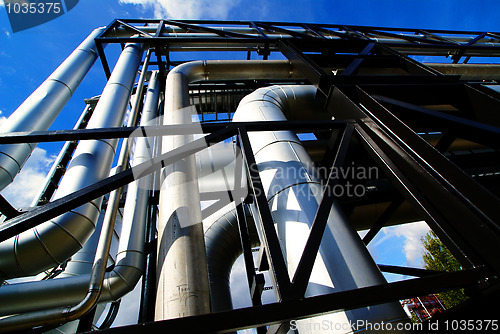 Image of Industrial zone, Steel pipelines and valves against blue sky