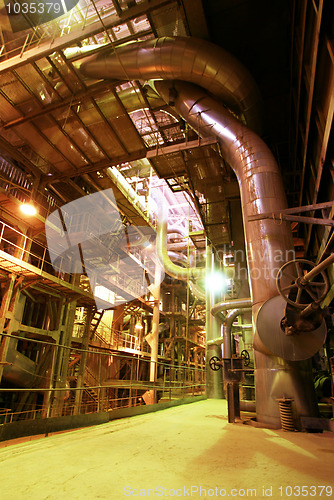 Image of Equipment, cables and piping as found inside of a modern industr