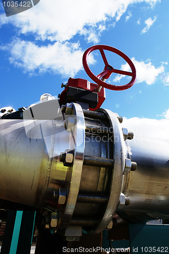 Image of Industrial zone, Steel pipelines and valves against blue sky