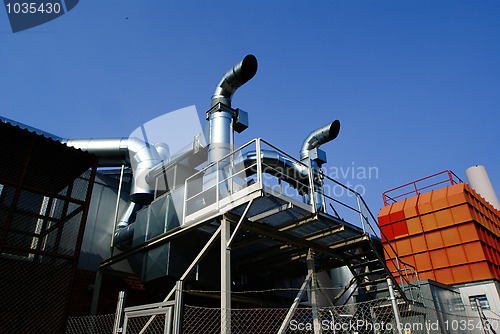 Image of Industrial zone, Steel pipelines and valves against blue sky