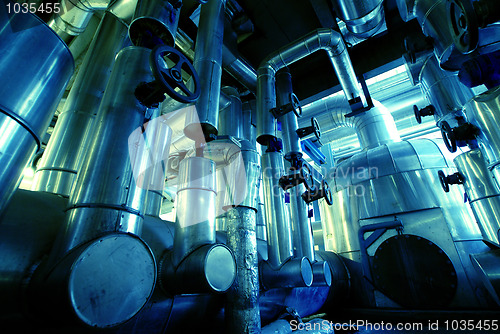 Image of Industrial zone, Steel pipelines, valves and ladders in blue ton