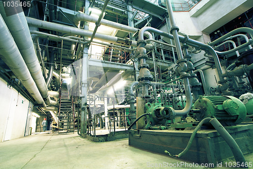 Image of Equipment, cables and piping as found inside of a modern industr