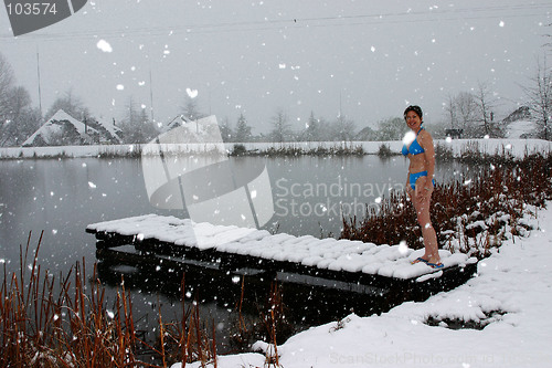 Image of Woman in snow with bikini
