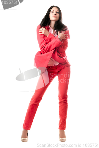 Image of Sexy young brunette in red suit. Isolated