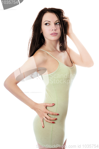 Image of Young brunette in olive dress