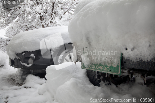 Image of cars covered by snow after winter storm