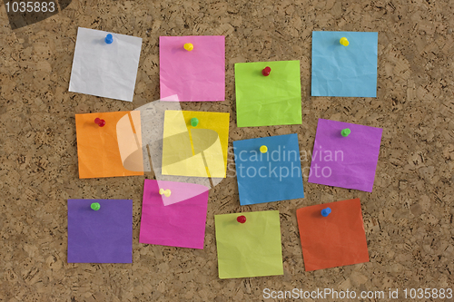 Image of colorful blank notes on cork board