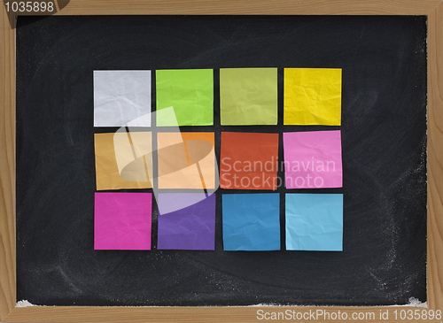 Image of colorful sticky notes on blackboard