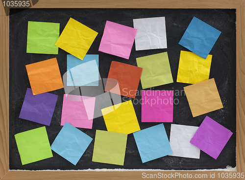 Image of colorful blank notes on blackboard