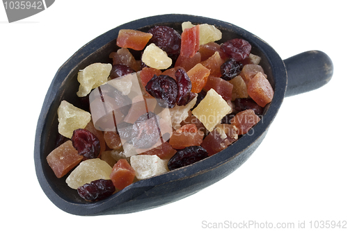 Image of scoop of dried cranberries, papaya and pineapple fruit