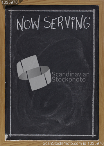 Image of now serving on blackboard