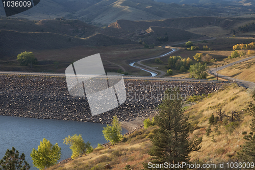 Image of rock dam on mountain reservoir in Colorado