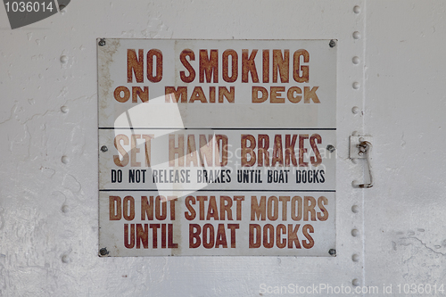 Image of no smoking warning sign on a vintage ferry ship