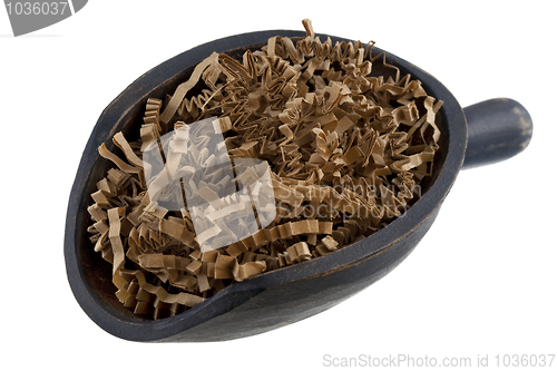 Image of scoop of brown shredded paper, recycling concept