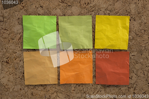 Image of blank crumpled sticky notes in earth colors