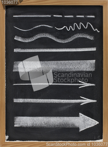 Image of lines and arrows - white chalk on blackboard