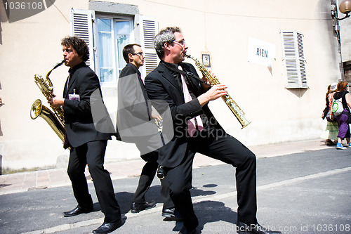 Image of Three musicians in the street.