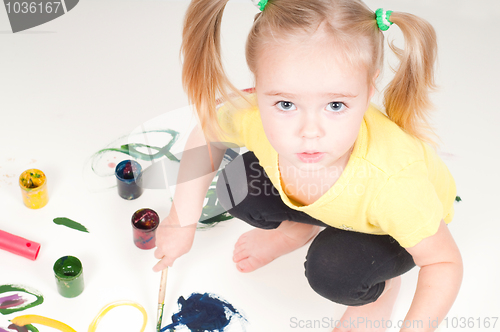 Image of Little girl painting