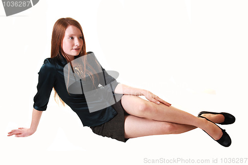Image of Girl sitting on floor.