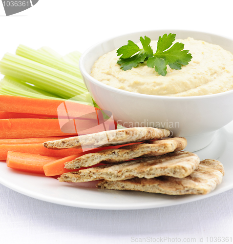 Image of Hummus with pita bread and vegetables