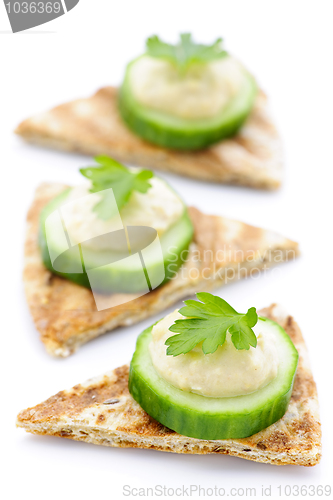 Image of Appetizer of pita with hummus and cucumber